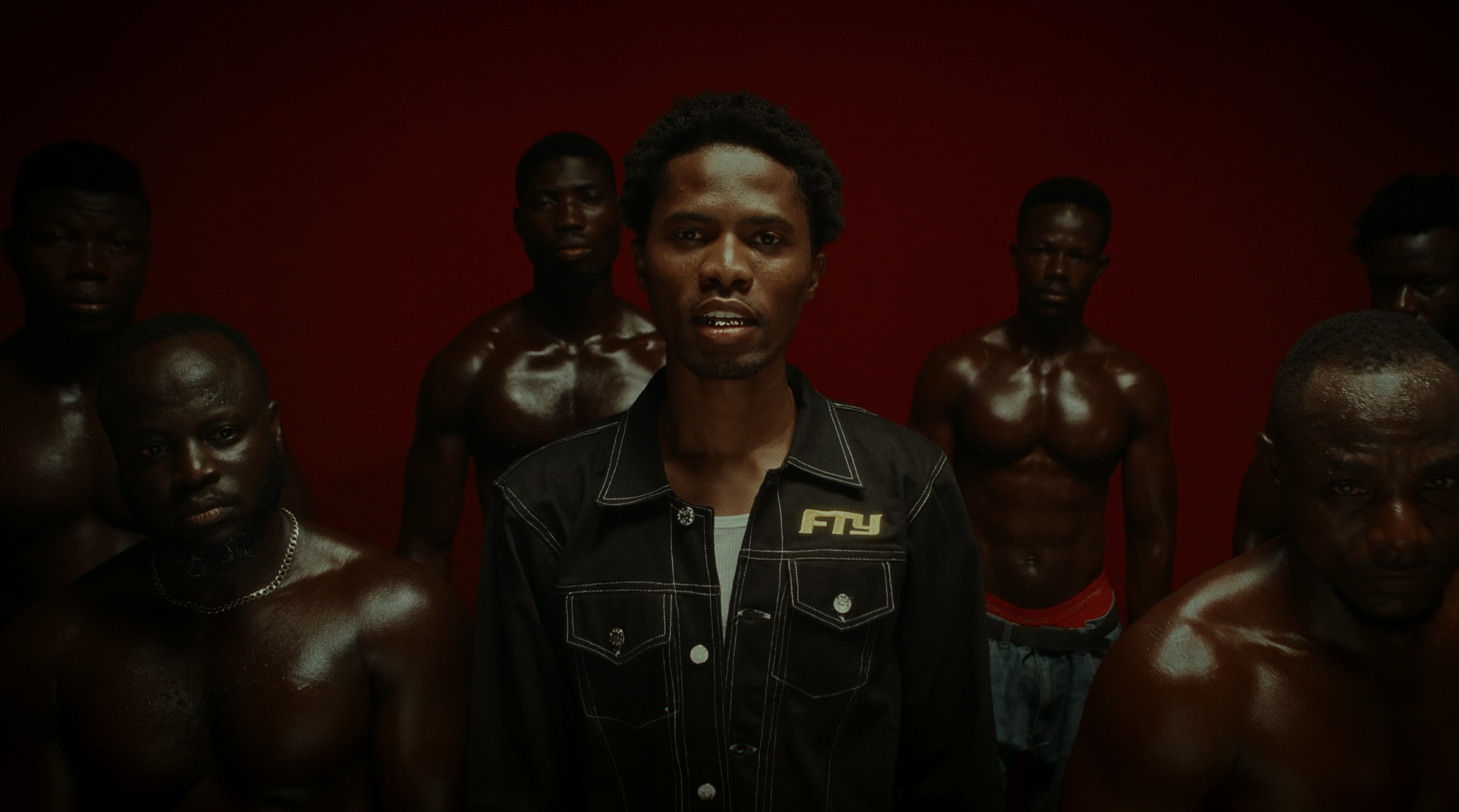 Screen grabs from the “FEFE NE FE” music video by Kwesi Arthur. Color ...